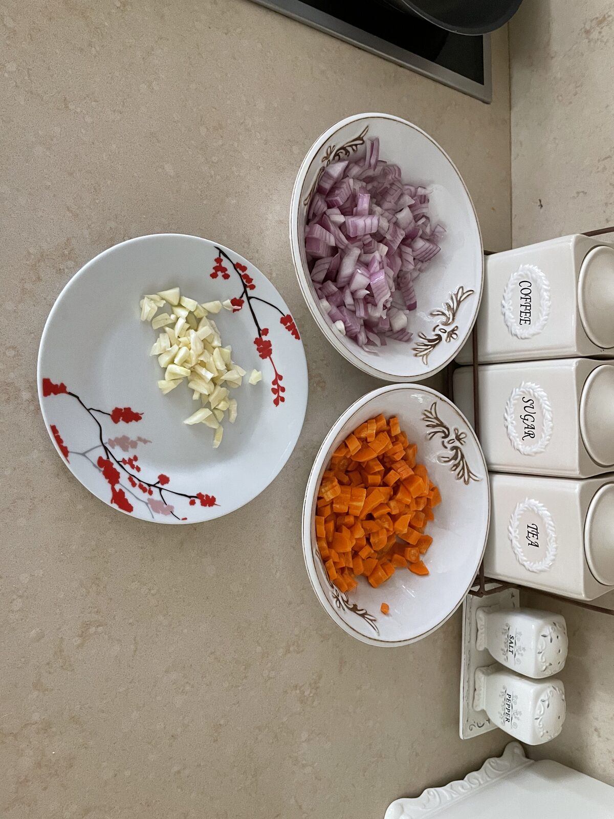 Shallots, paprika, carrots, and garlic, diced and ready